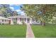 Charming single-story home with a well-maintained lawn and mature tree at 1779 Rosewood Rd, Decatur, GA 30032