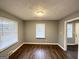 Spacious living room with hardwood floors and abundant natural light from windows at 1779 Rosewood Rd, Decatur, GA 30032