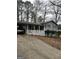 Charming home featuring a welcoming front porch and a convenient carport at 9055 Kelly Ct, Jonesboro, GA 30236
