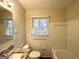 Bathroom with white tile, granite countertop, and a well-lit and functional design at 2004 Shamrock Dr, Decatur, GA 30032