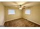 Bedroom featuring neutral walls, carpeting, a ceiling fan, and natural light through the window at 2004 Shamrock Dr, Decatur, GA 30032