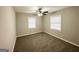 Neutral bedroom featuring carpet, two windows with blinds, ceiling fan and light walls at 3011 Belvedere Ln, Decatur, GA 30032