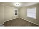 Bedroom featuring fresh paint, neutral carpet and two windows at 3011 Belvedere Ln, Decatur, GA 30032