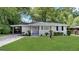 Charming single-story home with a well-manicured lawn and a convenient carport at 3011 Belvedere Ln, Decatur, GA 30032