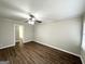 A bright room with wood floors and a ceiling fan at 3011 Belvedere Ln, Decatur, GA 30032