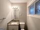 Bathroom featuring granite countertops, a mirror and a toilet at 3696 Aldea Dr, Decatur, GA 30032