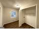 Bedroom with wood floors, a window, and a closet with sliding doors at 3696 Aldea Dr, Decatur, GA 30032