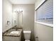 Bathroom featuring a granite countertop, well-lit mirror, and ample natural light at 3711 Tulip Dr, Decatur, GA 30032