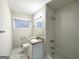 Well-lit bathroom with granite countertop vanity and tiled shower-tub combo at 3711 Tulip Dr, Decatur, GA 30032