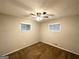 Bright bedroom with neutral walls, ceiling fan, and cozy carpeting at 3711 Tulip Dr, Decatur, GA 30032