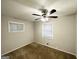 Bedroom with ceiling fan, neutral paint, and cozy carpeted floors at 3711 Tulip Dr, Decatur, GA 30032
