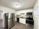 Modern kitchen featuring stainless steel appliances, sleek cabinets, and granite countertops at 3711 Tulip Dr, Decatur, GA 30032
