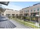 Balcony with black metal railings overlooking green space and brick buildings at 1028 Robert Smalls Way, Atlanta, GA 30318
