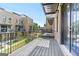 Balcony with black metal railings overlooking green space and brick buildings at 1028 Robert Smalls Way, Atlanta, GA 30318