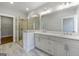 Bathroom with double sink vanity, glass shower, and neutral color palette at 1028 Robert Smalls Way, Atlanta, GA 30318