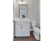 Contemporary bathroom with vanity with marble countertop, and white toilet at 1028 Robert Smalls Way, Atlanta, GA 30318