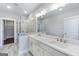 Modern bathroom featuring double sinks, a large mirror, and a glass-enclosed shower with stylish tile, offering a spa-like experience at 1028 Robert Smalls Way, Atlanta, GA 30318