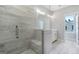 Bright bathroom featuring glass enclosed shower with bench and grey tiling at 1028 Robert Smalls Way, Atlanta, GA 30318