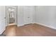 Bright bedroom boasts wood floors, access to ensuite bathroom and closet at 1028 Robert Smalls Way, Atlanta, GA 30318