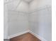 Walk-in closet with built-in white wire shelving and hardwood floors at 1028 Robert Smalls Way, Atlanta, GA 30318