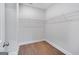 Walk-in closet with built-in wire shelving and hardwood floors at 1028 Robert Smalls Way, Atlanta, GA 30318