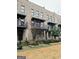 Brick townhome featuring a metal balcony with wrought iron railings, offering a stylish, modern exterior at 1028 Robert Smalls Way, Atlanta, GA 30318