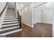 Open hallway with hardwood floors and staircase leading to the upper level at 1028 Robert Smalls Way, Atlanta, GA 30318