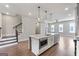 Bright kitchen features a large island with marble countertop and stainless steel appliances at 1028 Robert Smalls Way, Atlanta, GA 30318