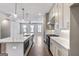Bright kitchen features a large island with marble countertop and stainless steel appliances at 1028 Robert Smalls Way, Atlanta, GA 30318