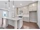 Bright kitchen features a large island with marble countertop and stainless steel appliances at 1028 Robert Smalls Way, Atlanta, GA 30318
