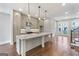 Modern kitchen with a large island, pendant lighting, and stainless steel appliances at 1028 Robert Smalls Way, Atlanta, GA 30318