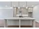 Bright kitchen features a large island with marble countertop and stainless steel appliances at 1028 Robert Smalls Way, Atlanta, GA 30318