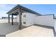 Stylish rooftop deck featuring gray flooring, white storage, and a covered area with sleek gray beams, perfect for outdoor relaxation at 1028 Robert Smalls Way, Atlanta, GA 30318