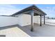 Outdoor rooftop deck featuring gray flooring, white storage, and a covered area with gray beams offering a relaxing outdoor space at 1028 Robert Smalls Way, Atlanta, GA 30318