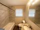 Updated bathroom featuring marble tile, granite vanity, and modern fixtures at 105 Hillside Se Ave, Atlanta, GA 30315