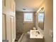 Modern bathroom featuring marble floors, a glass-door shower, and a vanity at 105 Hillside Se Ave, Atlanta, GA 30315