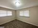 Cozy bedroom with plush carpet, neutral walls, and natural light from the window at 105 Hillside Se Ave, Atlanta, GA 30315