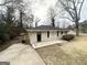 Lovely single-story brick home with a concrete driveway and cozy curb appeal in a quiet neighborhood at 105 Hillside Se Ave, Atlanta, GA 30315
