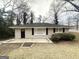 Inviting single-story brick home with a well-maintained lawn and classic architectural details at 105 Hillside Se Ave, Atlanta, GA 30315