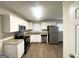Modern kitchen featuring stainless steel appliances, granite countertops, and updated white cabinetry at 105 Hillside Se Ave, Atlanta, GA 30315