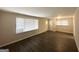 Spacious living room with newly refinished floors and light-filled windows, ready for your personal touch at 105 Hillside Se Ave, Atlanta, GA 30315