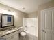 Bathroom featuring granite vanity, tile flooring, and shower-tub combination at 5468 Pepperwood Ct, Stone Mountain, GA 30087