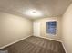 Cozy bedroom with neutral carpet, window, and closet at 5468 Pepperwood Ct, Stone Mountain, GA 30087