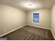 Comfortable bedroom with neutral carpet and natural light at 5468 Pepperwood Ct, Stone Mountain, GA 30087