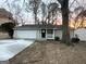 Charming single-story home with a garage and welcoming front porch at 5468 Pepperwood Ct, Stone Mountain, GA 30087