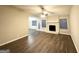 Spacious living room featuring hardwood floors and a stone fireplace at 5468 Pepperwood Ct, Stone Mountain, GA 30087