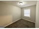 Small neutral bedroom with plush carpet, and natural paint at 1158 Edgefield Sw Dr, Atlanta, GA 30310