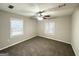 Neutral bedroom with plush carpet, neutral paint, and a ceiling fan at 1158 Edgefield Sw Dr, Atlanta, GA 30310
