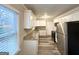 Bright kitchen with stainless steel appliances, white cabinets, and granite counters at 1158 Edgefield Sw Dr, Atlanta, GA 30310