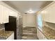 Bright kitchen with stainless steel appliances, white cabinets, and granite countertops at 1158 Edgefield Sw Dr, Atlanta, GA 30310